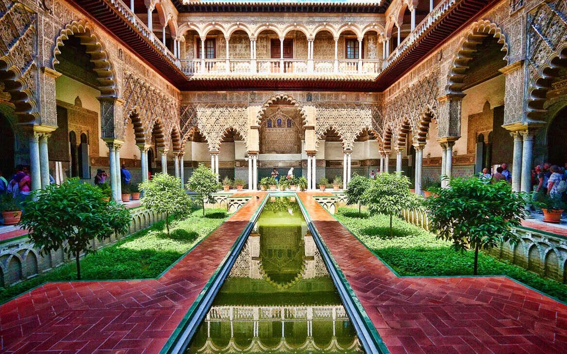 The Patio de las Doncellas in the Real Alcázar, Seville, with its long reflecting pool